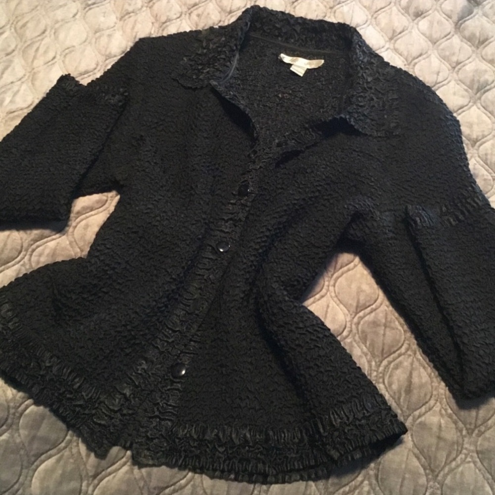 Beautifully Made Black Blouse with long sleeves, is a button up with collar.